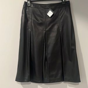 Halogen A-line leather skirt. Never worn. 100% leather/polyester lining. Size 6